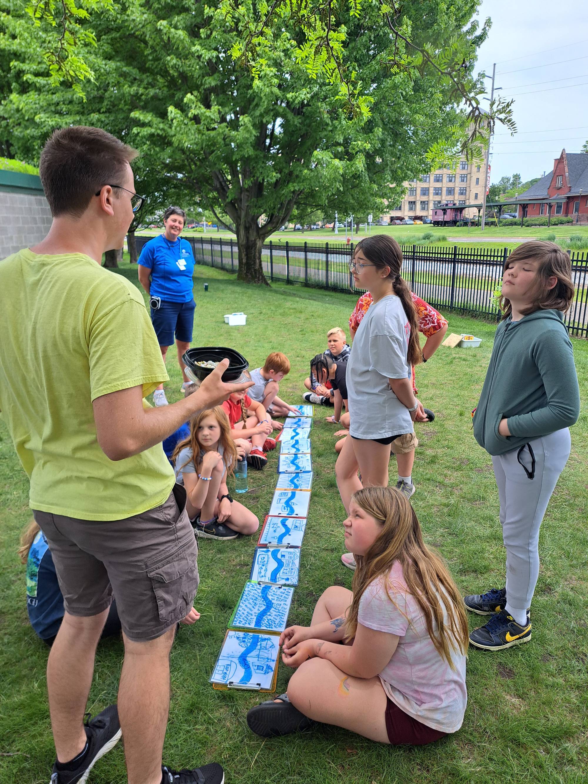 Instructor talking to students outside